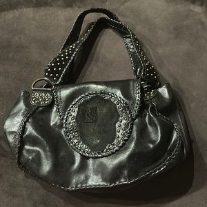 BCBGirls black leather gold studded purse BCBG shield emblem purple interior
